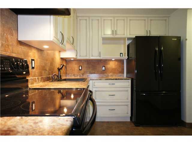 Original kitchen listing photograph for 203–5790 Patterson Avenue, Burnaby
